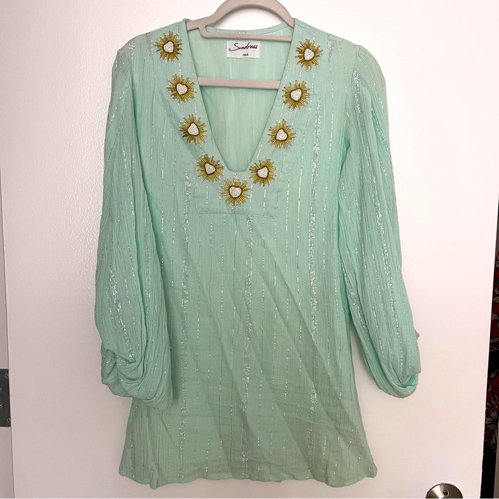 mini sundress with ornate detail and pouf sleeves